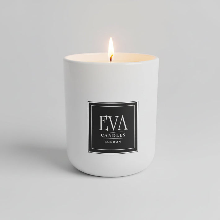 White candle with 'EVA CANDLES LONDON' label on a neutral background