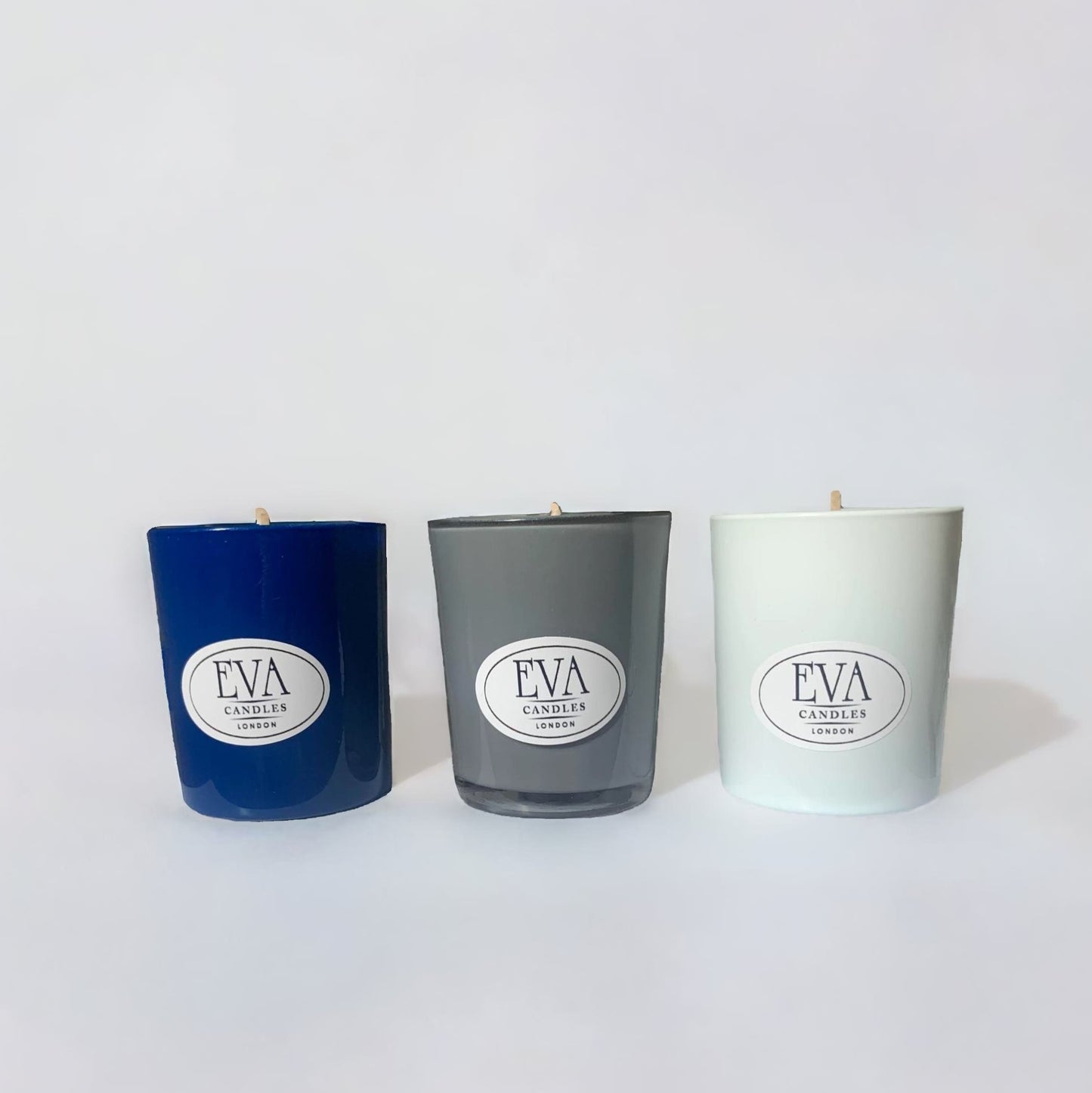 Set of three candles blue grey and white